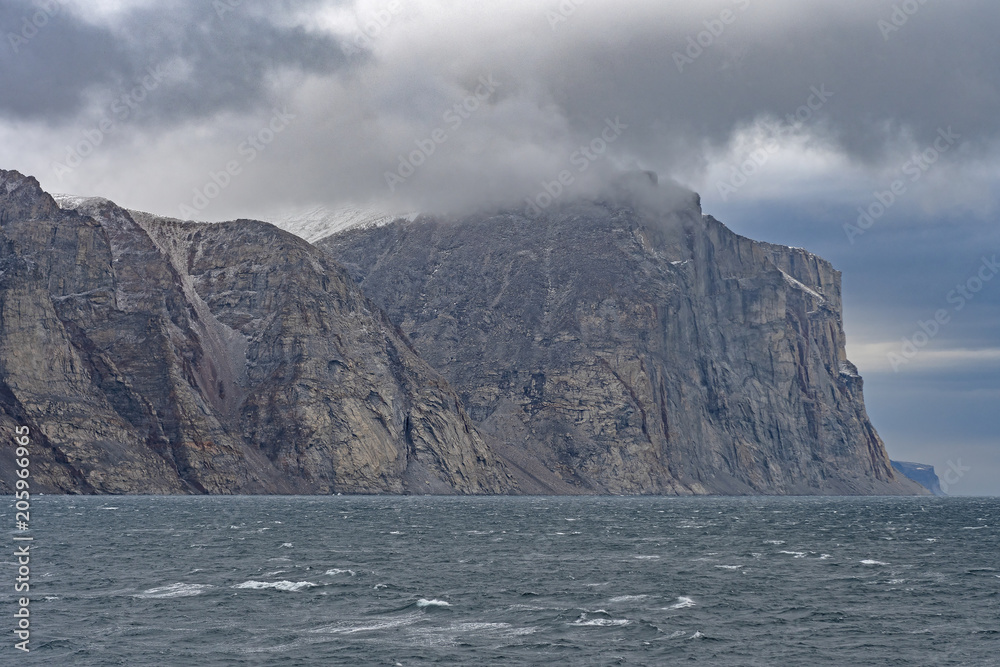 Looming Cliffs on a Coastal Fjord