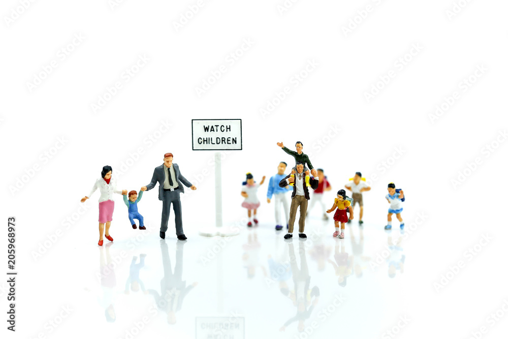 Miniature people : student or children crossing road on way to school,Back to school concept.