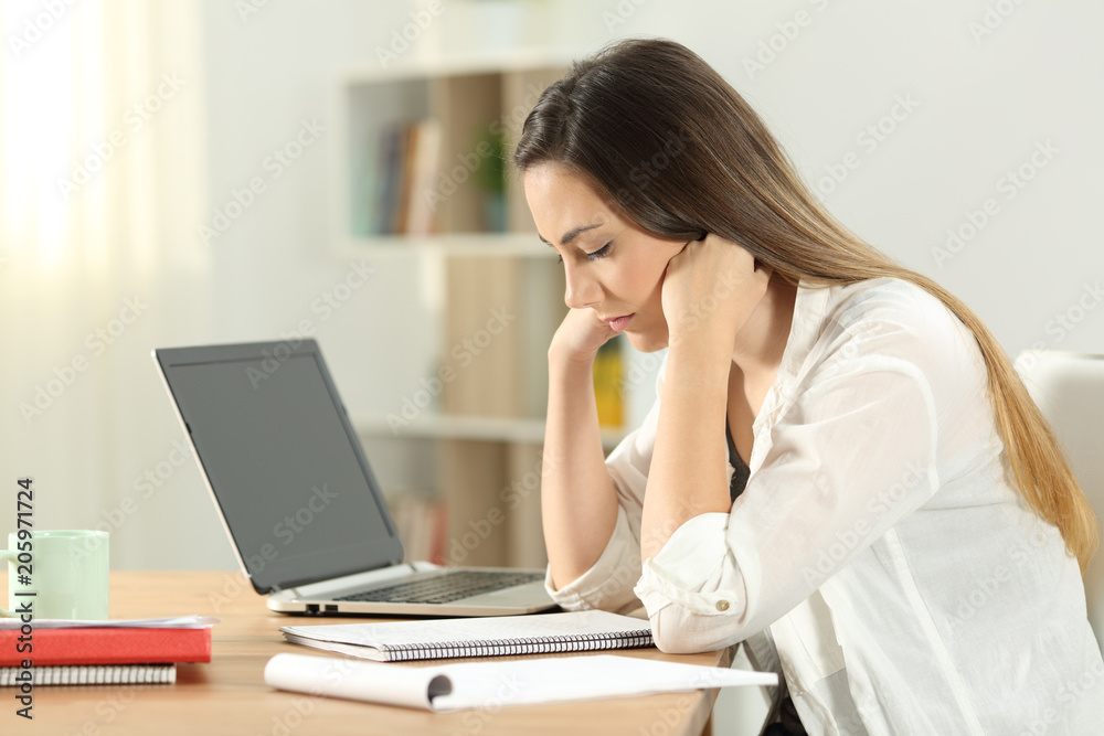 Single student studying memotizing notes at home Single student studying memotizing notes at home