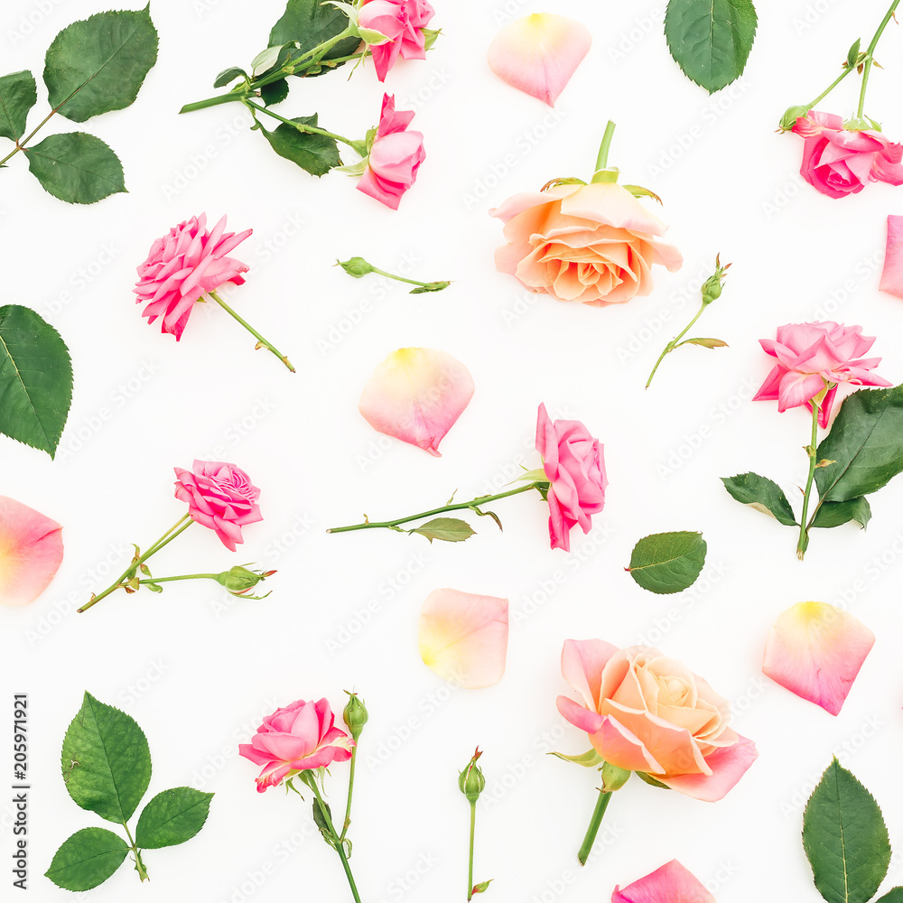Floral pattern with roses, petals and green leaves on white background. Flat lay, top view.