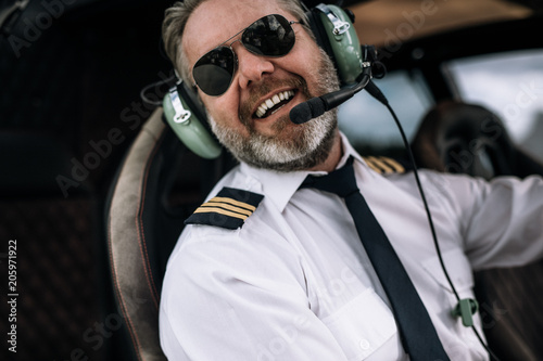 Smiling helicopter pilot with headset