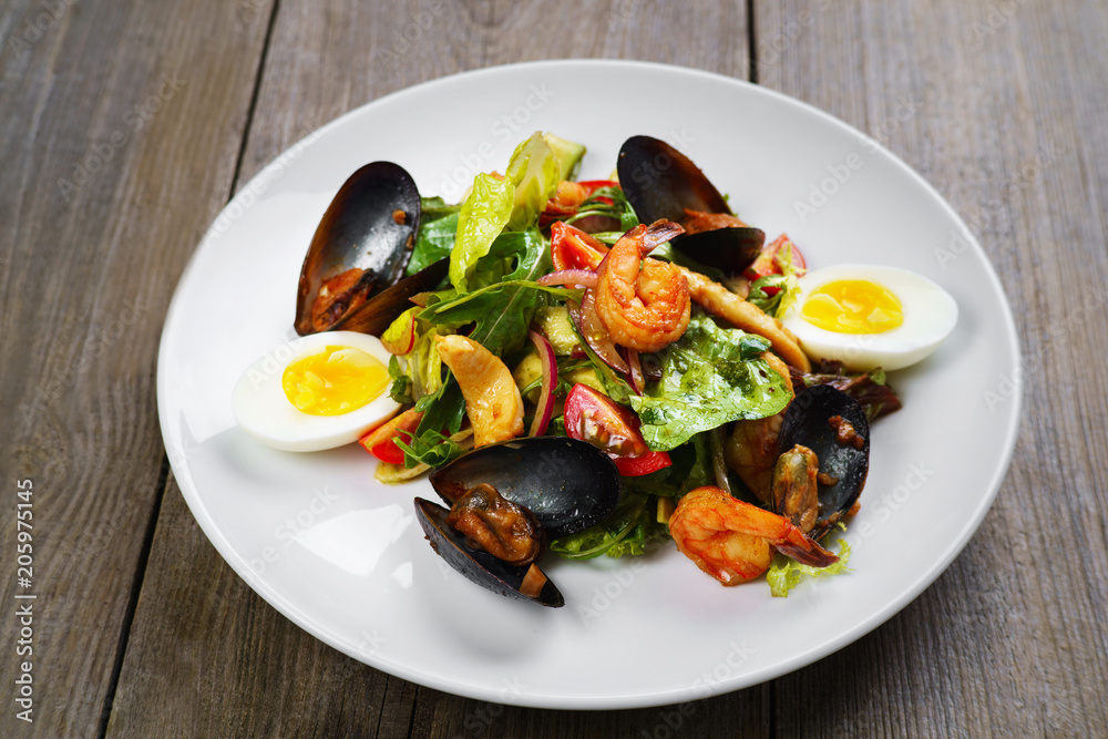 Appetizing gourmet Mediterranean seafood salad with shrimps and mussels, appetizer, banquet, restaurant menu, dining concept Appetizing gourmet Mediterranean seafood salad with shrimps and mussels, appetizer, banquet, restaurant menu, dining concept