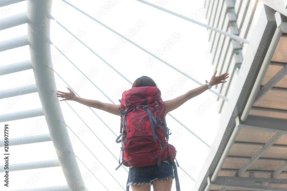 Traveler woman looking on a big city, travel and active lifestyle concept Traveler woman looking on a big city, travel and active lifestyle concept