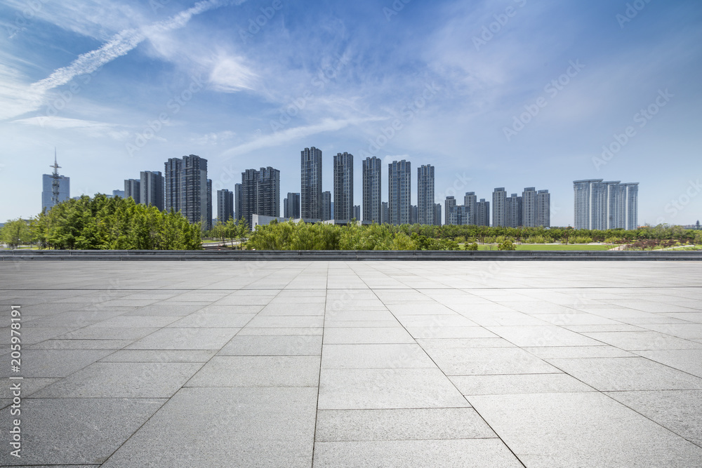 Panoramic skyline and modern business office buildings with empty road,empty concrete square floor