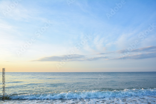 Sunrise at the sea. Seascape of the morning dawn. Early morning on the beach.