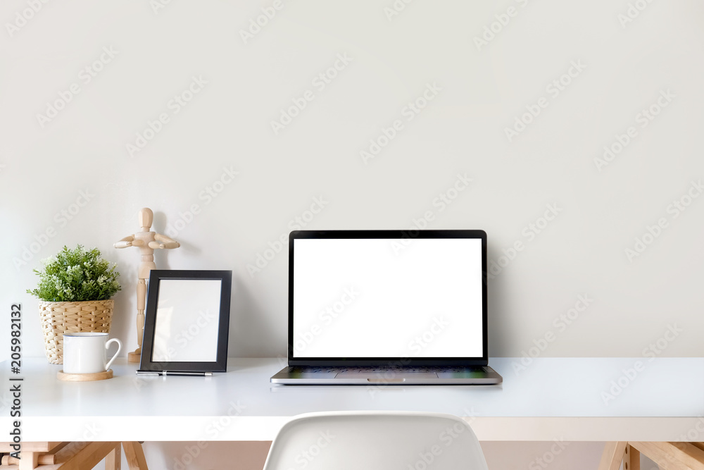 Loft workspace mock up laptop computer on wood table. copy space and blank screen for graphics montage. Loft workspace mock up laptop computer on wood table. copy space and blank screen for graphics montage.