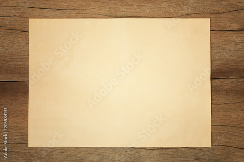 Old blank paper on vintage wooden floor and have copy space.
