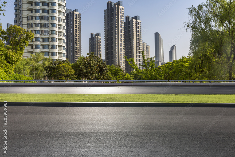 Obraz premium Modern business office buildings with empty road,empty concrete square floor