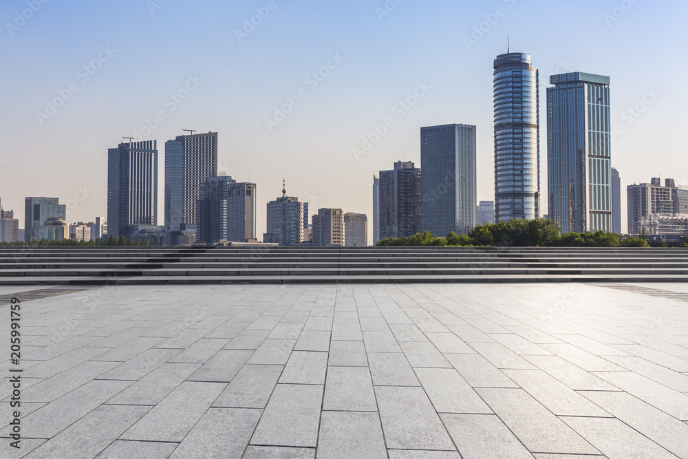 Panoramic skyline and buildings with empty concrete square floor