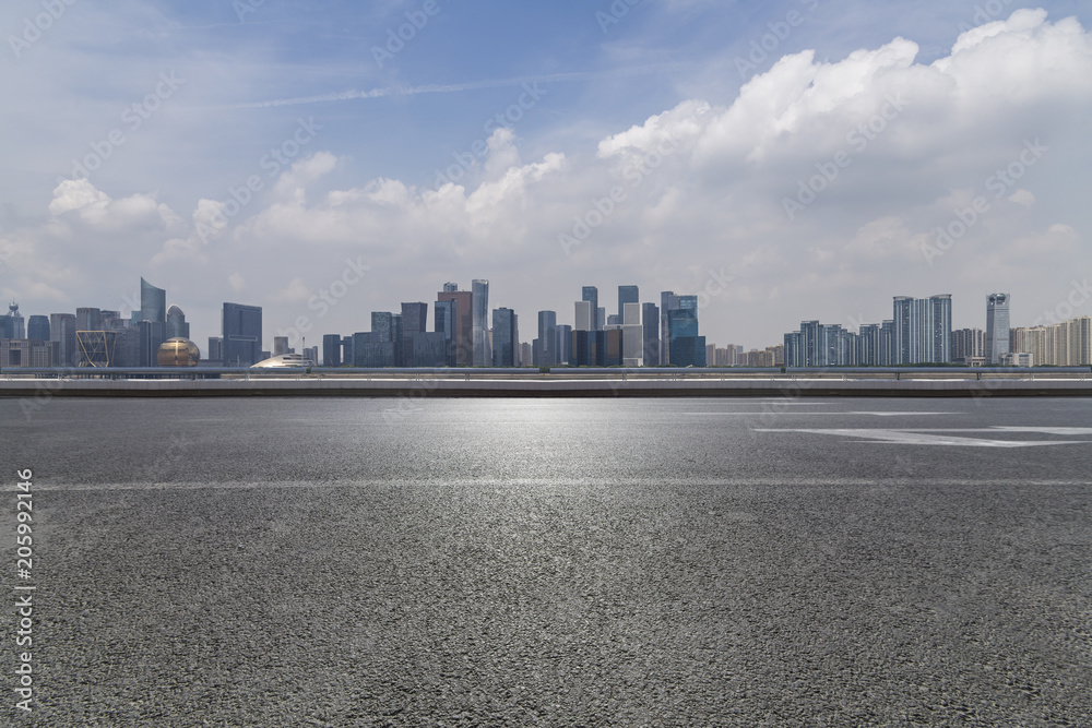 © MyCreative - Panoramic skyline and buildings with empty road © MyCreative - Panoramic skyline and buildings with empty road
