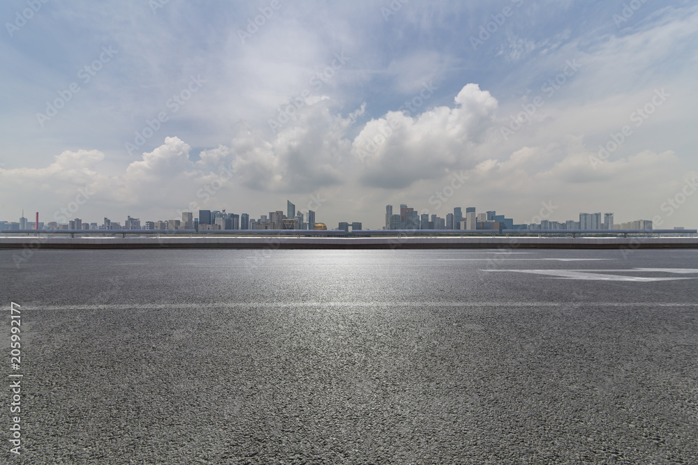 Panoramic skyline and buildings with empty road