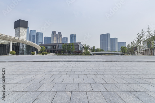 Panoramic skyline and buildings with empty concrete square floor © MyCreative