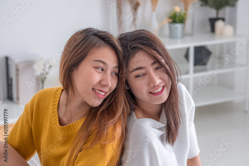 Asia lesbian lgbt couple hug and sitting on bed near white window sunlight with happiness moment together,love wins concept.