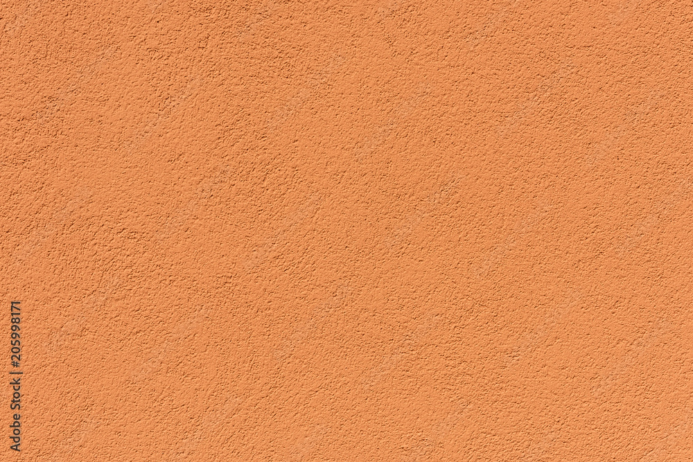 Fototapeta premium close-up view of orange rough weathered background