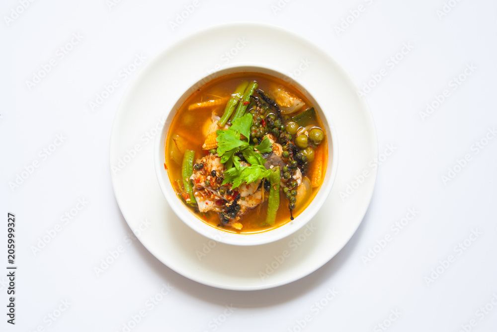 Thai spicy curry fish with vegetables in white bowl 2 Thai spicy curry fish with vegetables in white bowl 2