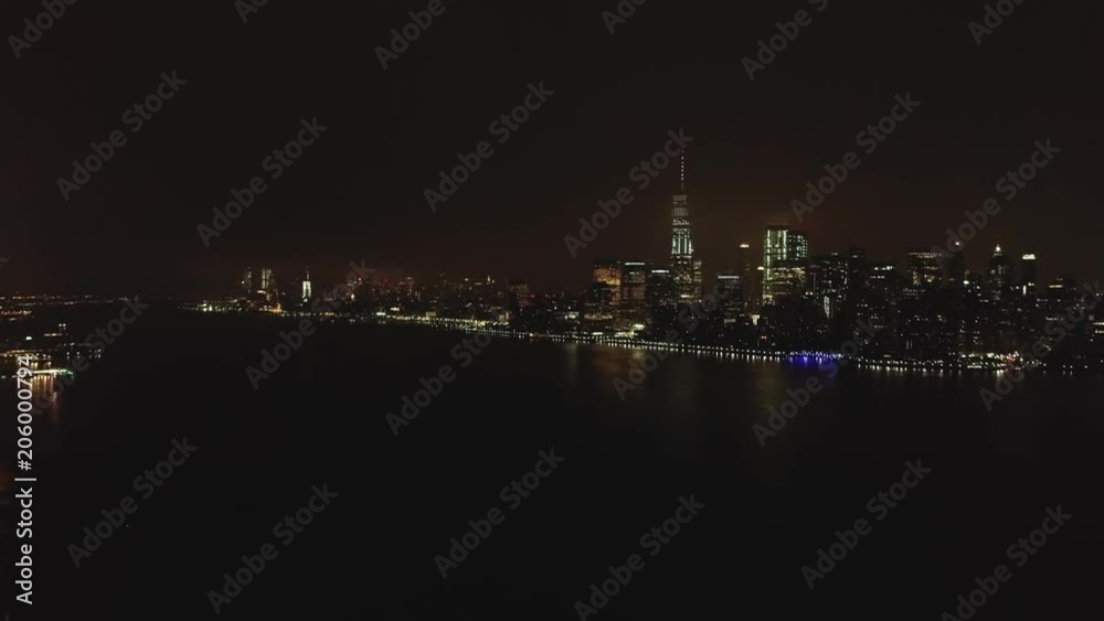 Aerial of Hudson river and Manhattan at Night