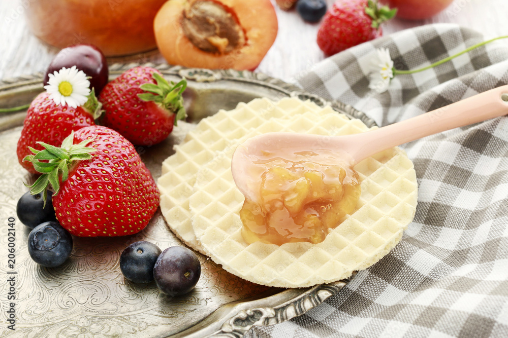 Tasty and healthy breakfast: waffles with fruit jam. Tasty and healthy breakfast: waffles with fruit jam.