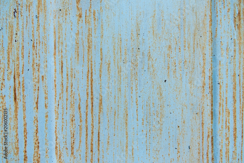 old scratched blue background with rust