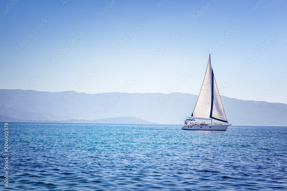 Sailing yacht in Mediterranean sea at sunset. Travel and active lifestyle concept