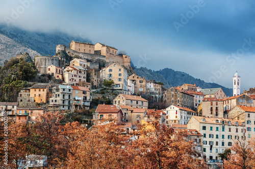 Corte, a beautiful city in the mountains on the island of Corsica, a view of the city and the mountains © olezzo