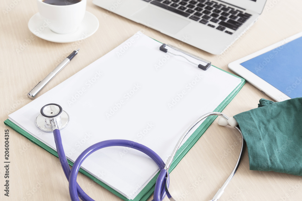 Blank medical clipboard and stethoscope on wooden desk, workplace of a doctor background. Blank medical clipboard and stethoscope on wooden desk, workplace of a doctor background.