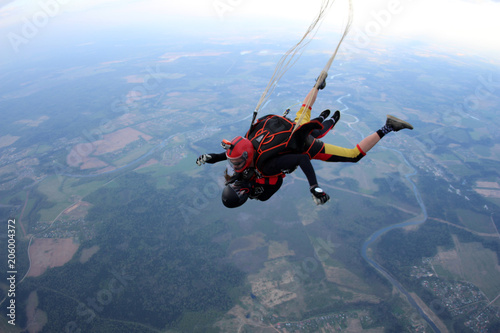Tandem skydiving. Face to face jump.