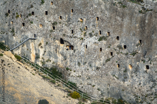 Covetes dels Moros with tourists in holes photo