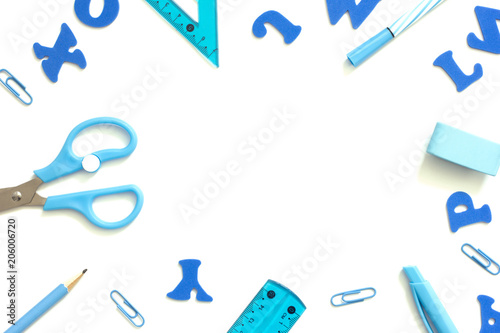 Obraz na plátne Blue school supplies on a white desk.Back to school background