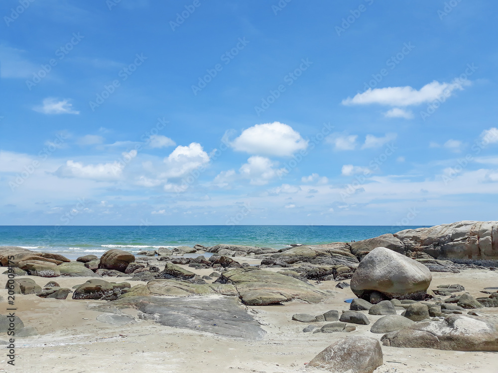 Thai beach with sea, stone, sand, cloud and sky