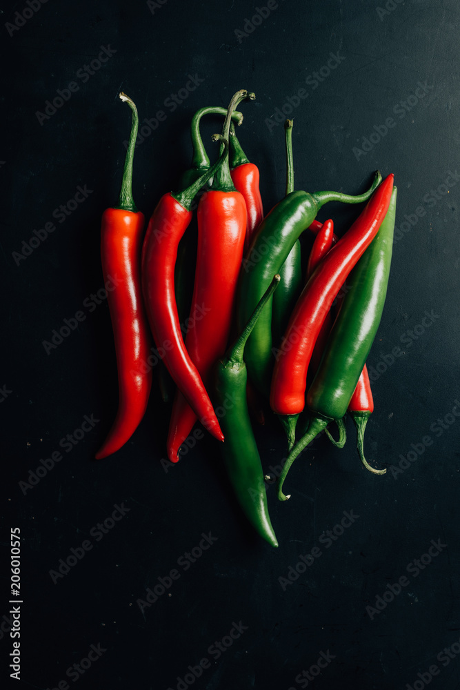 top view of red and green chili peppers on table