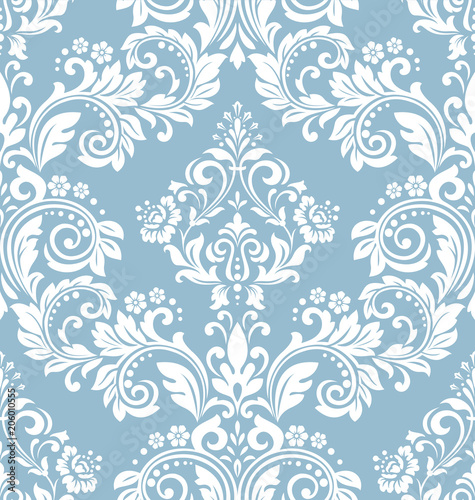 Wallpaper in the style of Baroque. A seamless vector background. White and blue floral ornament. Graphic pattern for fabric, wallpaper, packaging. Ornate Damask flower ornament