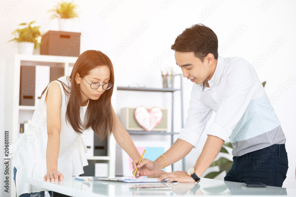 Fototapeta premium Young asian happy executives, employees discussing new project