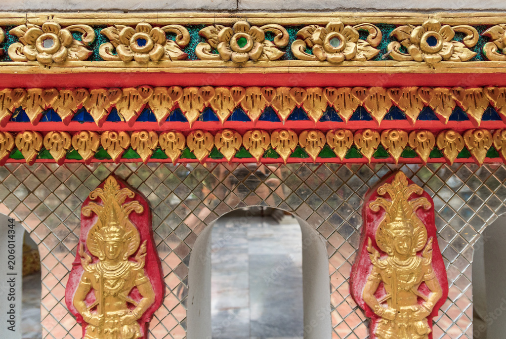 detail of beautiful decorative geometric ornaments with gemstones in Buddhist temple