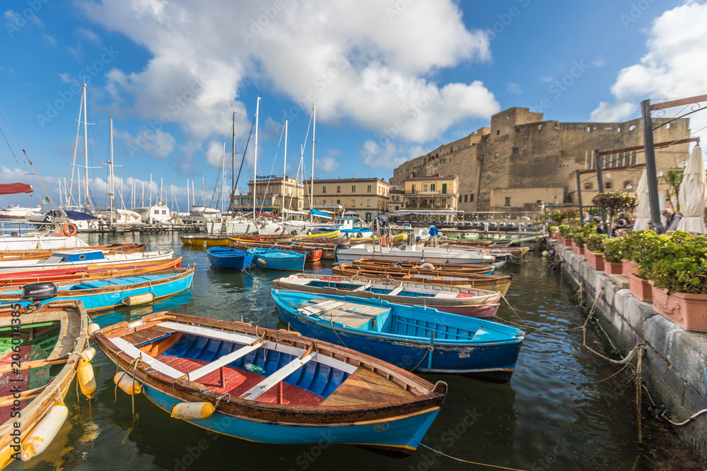 Boats near new castle in Naples Italy