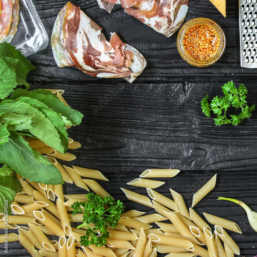 set of ingredients for pasta cooking - penne with cream sauce and pancheta  meal  - cuisine.  Food background