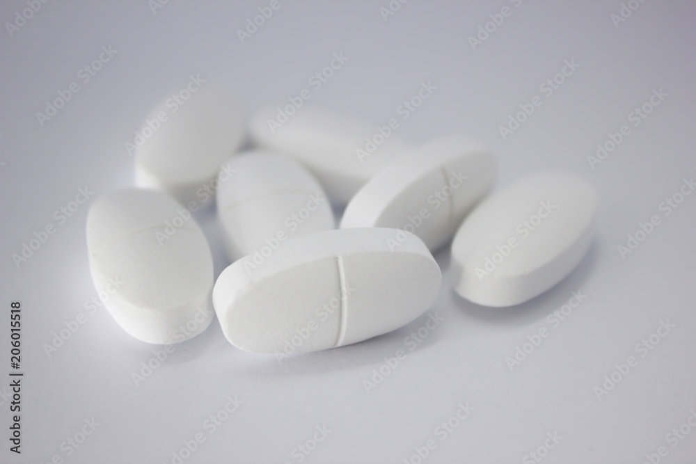 White pills. Sport supplement. Vitamins. BCAA, L-carnitine. White pills. Sport supplement. Vitamins. BCAA, L-carnitine.