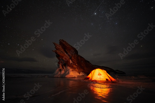 Incredible night landscape against the backdrop of a rocky island.