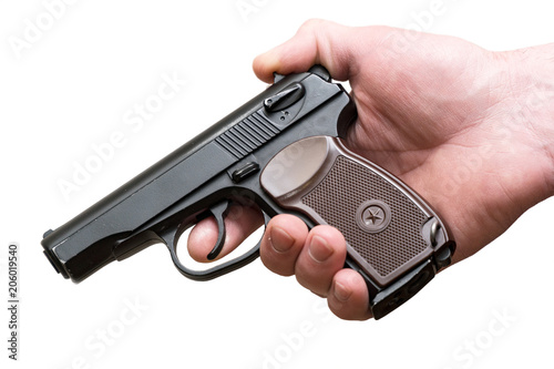 Pistol in the hands of a man isolated