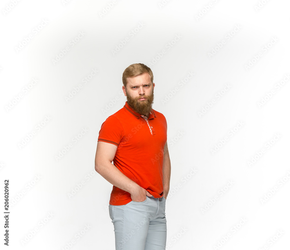 Closeup of young man's body in empty red t-shirt isolated on white background. Mock up for disign concept Closeup of young man's body in empty red t-shirt isolated on white background. Mock up for disign concept