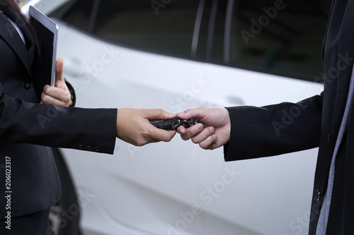 Canvas Print Close-up of the hand that is delivering the keys to the customer