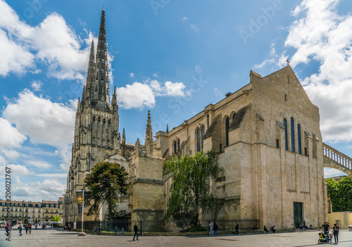Bordeaux, France, 9 may 2018 - tourist passing the Famous Cathédrale Saint-André de Bordeaux photo