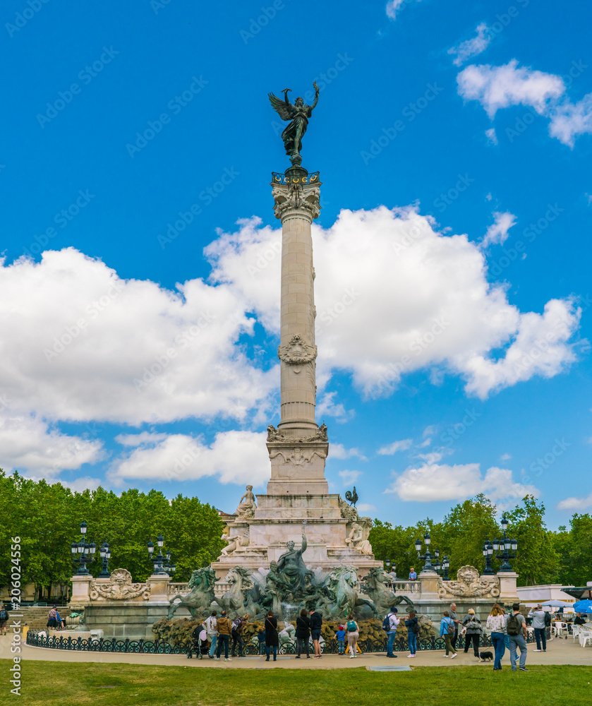 Bordeaux, France 10 May 2018: Tourist visiting the Famous Girondins Monument.'Monument aux Girondins' with statue's and fountain.
