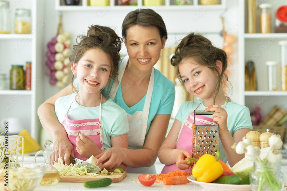Mom and daughters cook 