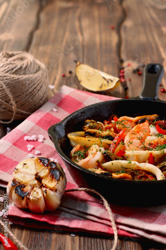 shrimp mussels and squid on frying pan morning light