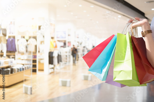 Closeup of woman holding shopping colorful of shopping bags at shopping mall with copy space - Shopping Concept