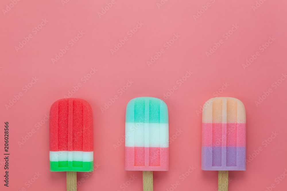 Table top view aerial image of food for summer holiday background concept.Flat lay variety ice cream pop stick on modern rustic pink paper wallpaper.Space for creative design for add text and content. Table top view aerial image of food for summer holiday background concept.Flat lay variety ice cream pop stick on modern rustic pink paper wallpaper.Space for creative design for add text and content.