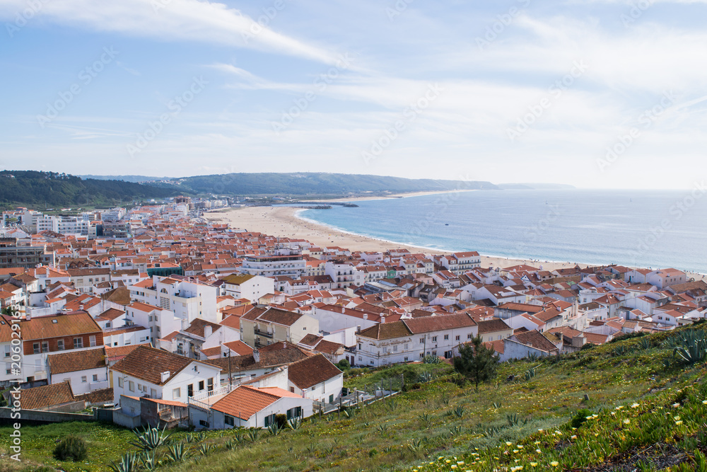 View over the rooftops of Nazare to the Atlantic Ocean in Portugal