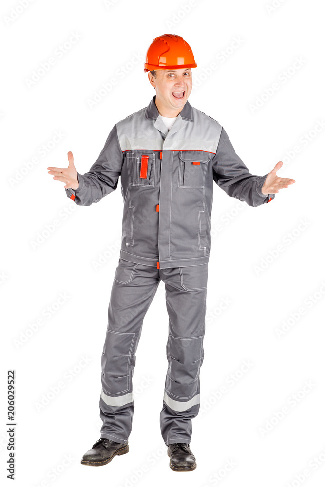 Full length portrait of a male builder in a helmet looking at camera over white wall background. repair, construction, building, people and maintenance concept. Full length portrait of a male builder in a helmet looking at camera over white wall background. repair, construction, building, people and maintenance concept.