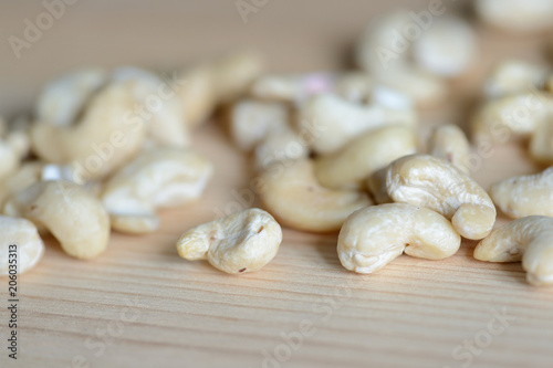 Cashew nuts on a wooden background close up