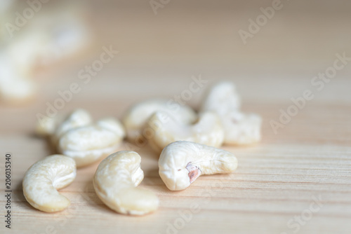 Cashew nuts on a wooden background close up
